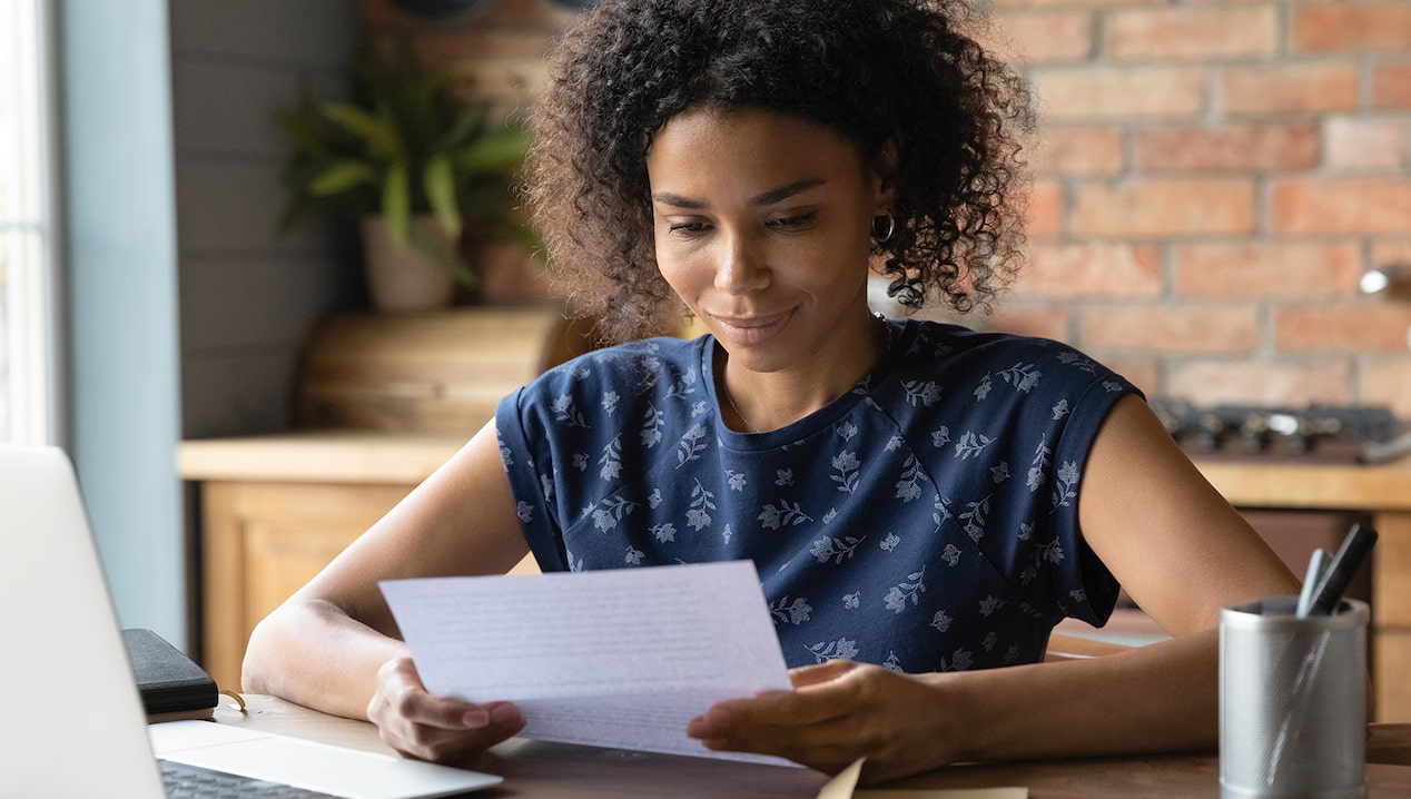 Woman reviewing her GM Business Card statement