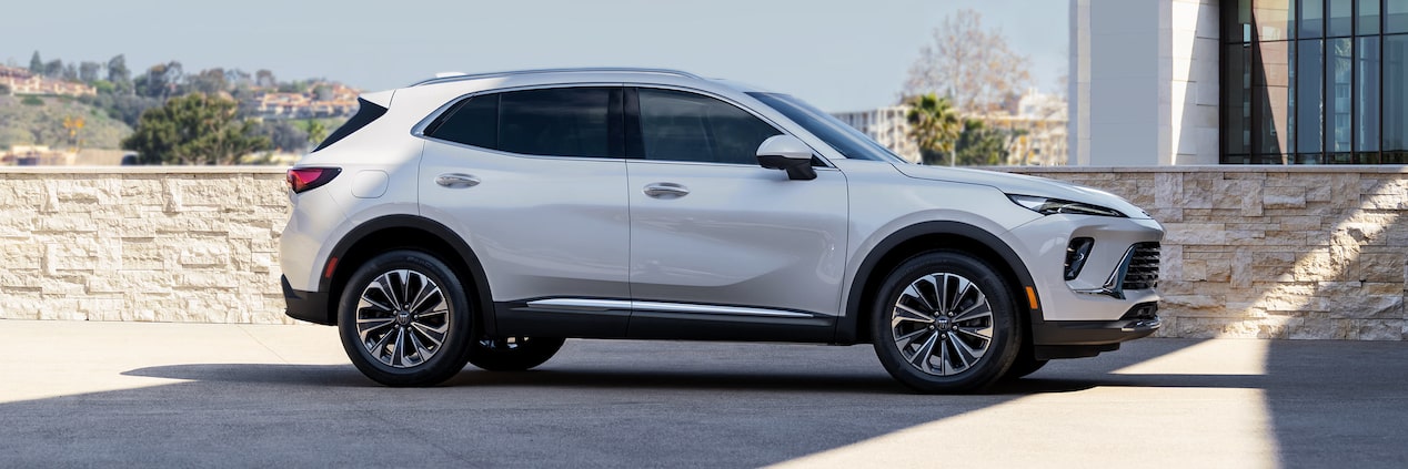 Wide Side View of a 2024 Buick Envision Sitting in an Empty Parking Lot