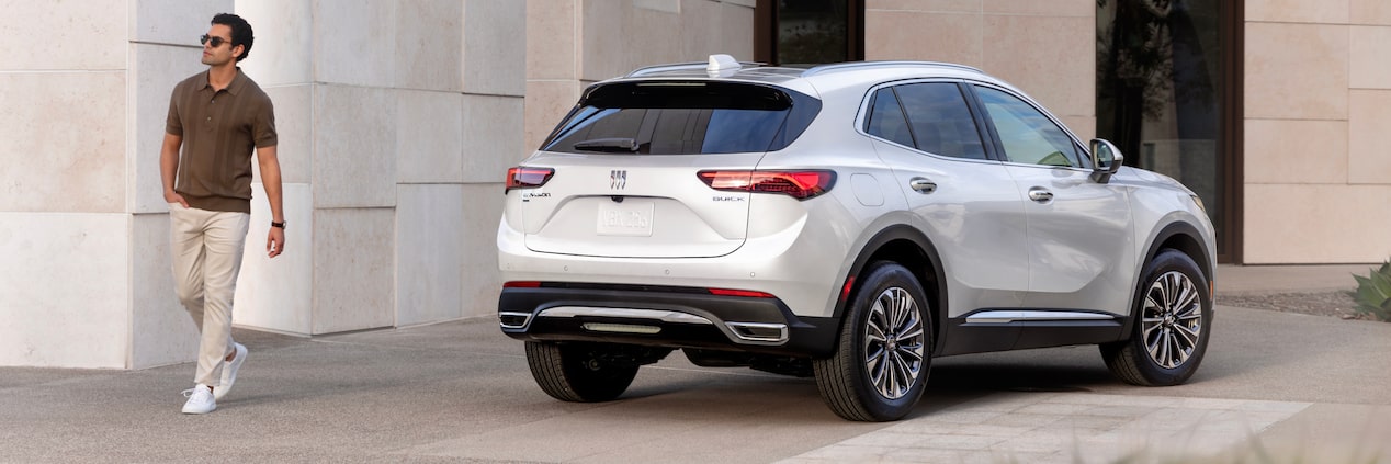 A Person Walking Away from Their 2024 Buick Envision SUV