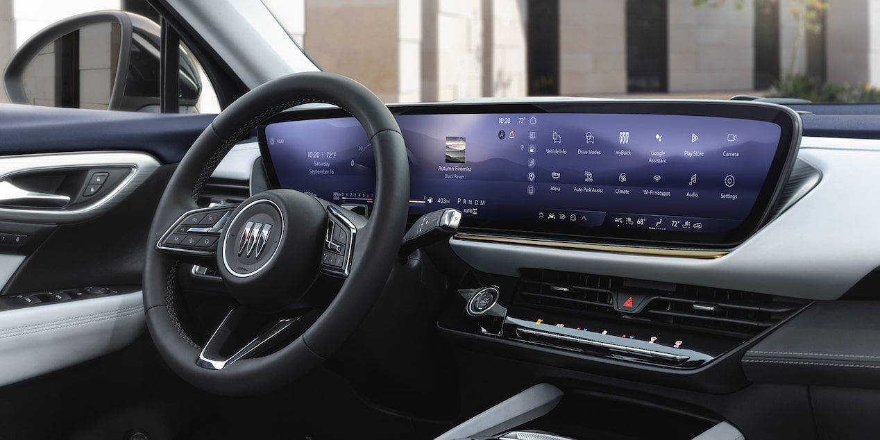 Interior View of the Driver's Seat, Infotainment System and Steering Wheel in a 2024 Buick Envision Compact SUV