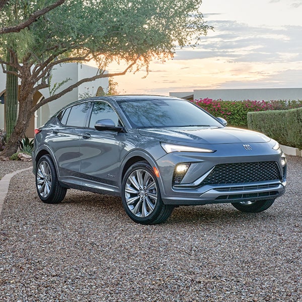 A Silver 2024 Buick Envista Parked on a Gravel Road