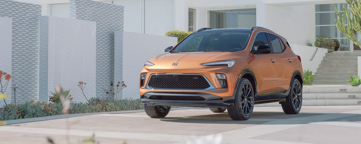 The 2024 Buick Encore GX ST Parked In Driveway Of Modern Home