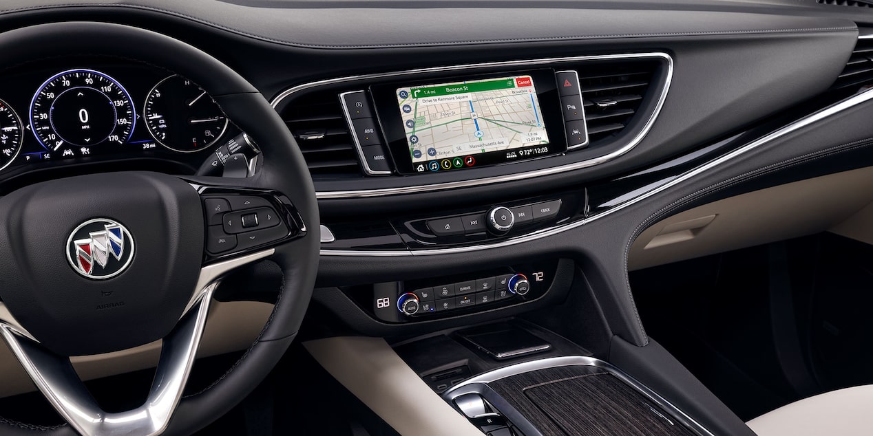 The Stylish Interior of a Buick with the Steering Wheel, Infotainment System Displaying GPC, and Heads-Up Display