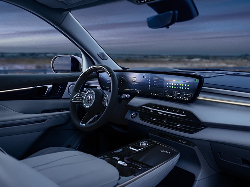 View of the Front Interior in a 2025 Buick Enclave Under the Evening Sky