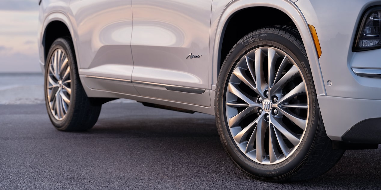 Low Angle View of the Tires and Doors on a 2025 White Buick Enclave