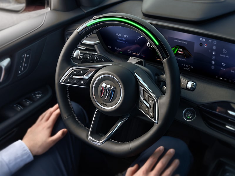 Close-up of the Steering Wheel with a Man Sitting in the Driver’s Seat of 2025 Buick Enclave with SuperCruise in Use