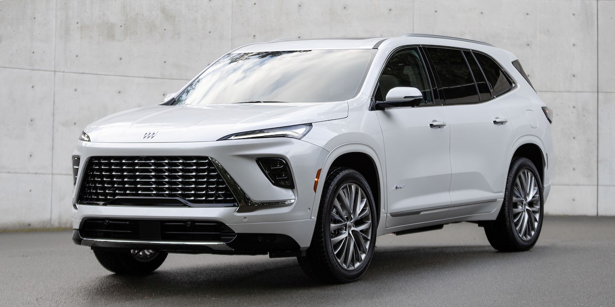 Three-Quarters View of a White 2025 Buick Enclave Surrounded by Walls