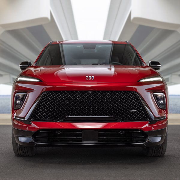 Front View of a 2025 Red Buick Enclave ST Under the Bridge