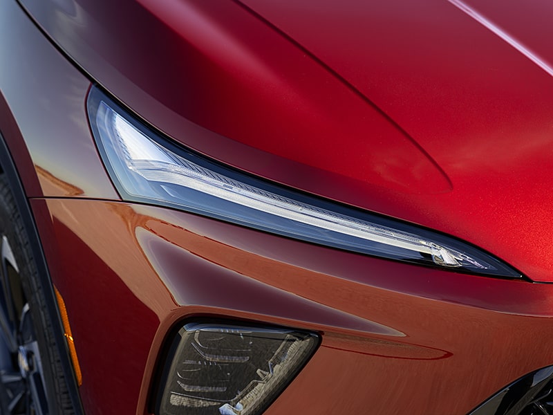 Close-up of the Front Headlight on a 2025 Red Buick Enclave ST