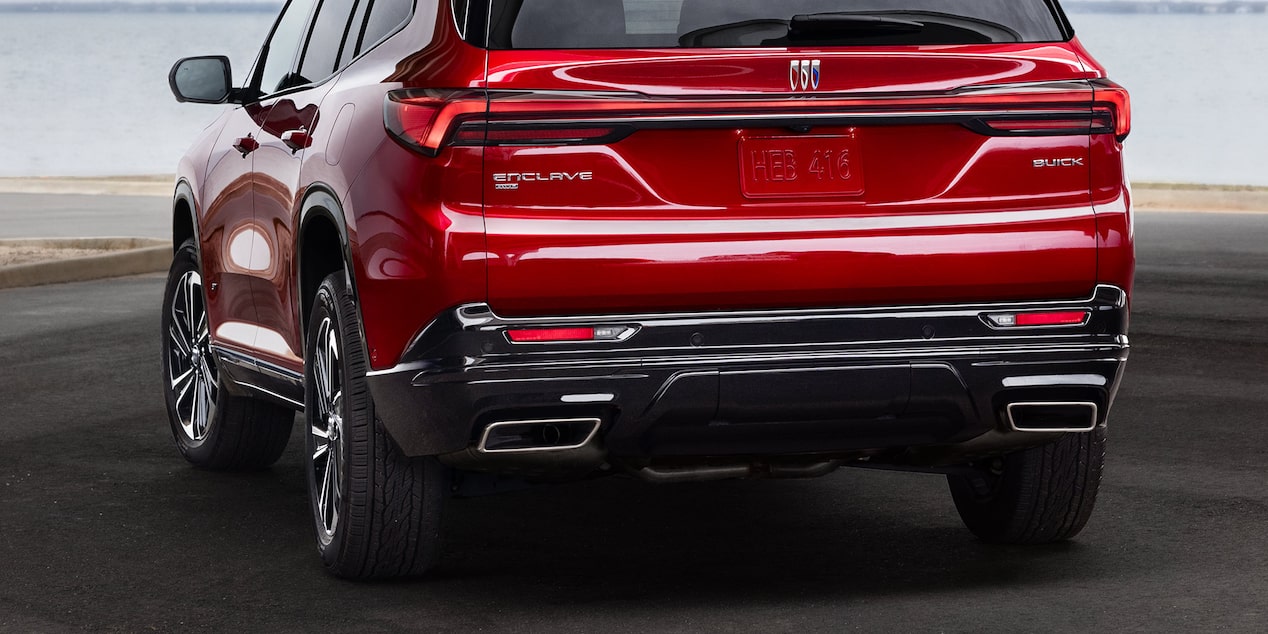 Rear View of a 2025 Red Buick Enclave ST Near a Lake