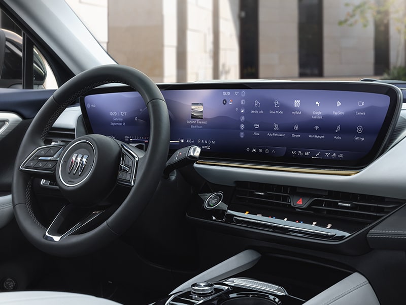 Wide Three-Quarters Interior View of the Steering Wheel and Digital Dashboard in a 2025 Buick Envision Compact SUV