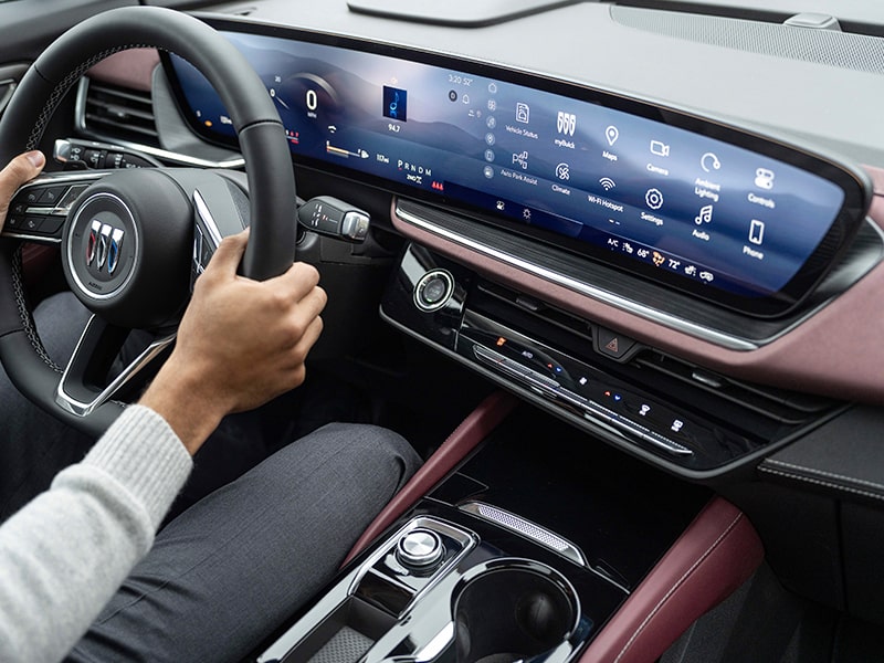 Wide Three-Quarters Overhead Interior View of the Steering Wheel and Digital Dashboard in a 2025 Buick Envision ST Sporty SUV