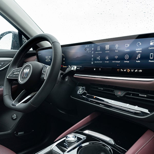 Close-up Three-Quarters Overhead Interior View of the Steering Wheel and Digital Dashboard in a 2025 Buick Envision ST Sporty SUV