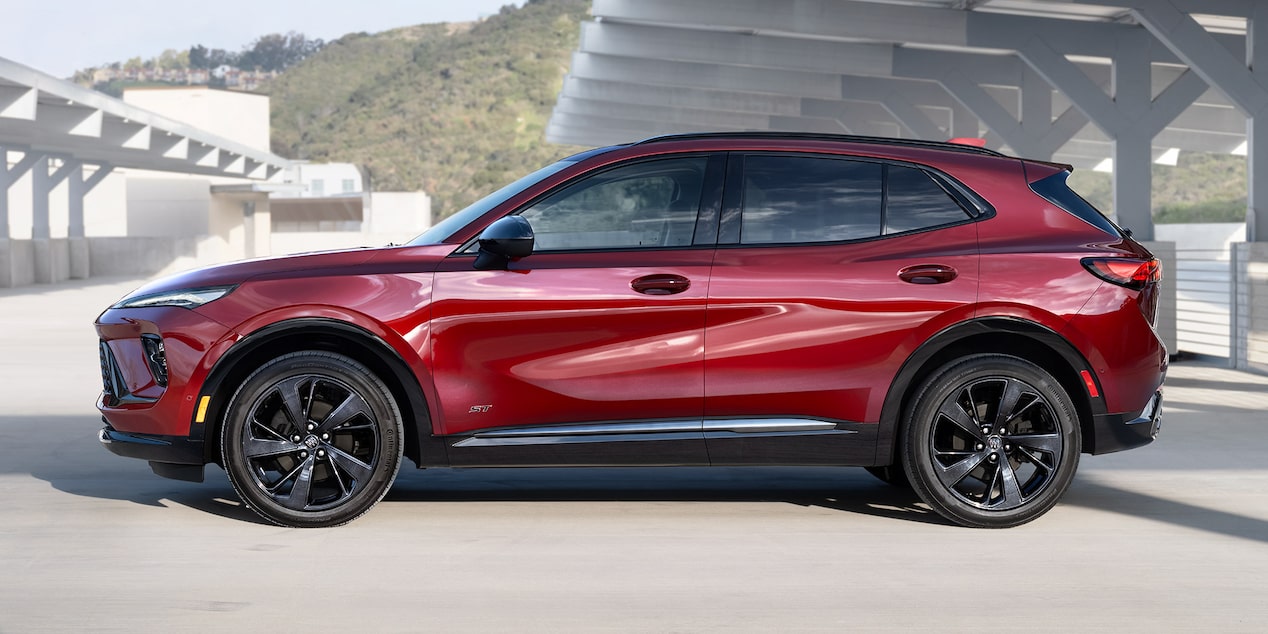 Side View of the 2025 Buick Envision ST AWD SUV Parked in an Empty Parking Lot