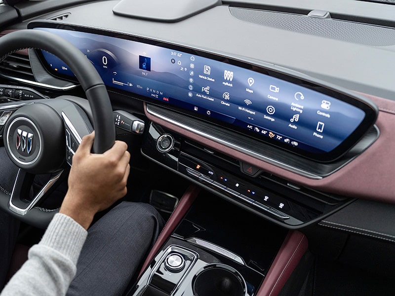 Close-up View of a Person's Hands on a Steering Wheel Showing the Digital Dashboard in a 2025 Buick Envision ST AWD SUV