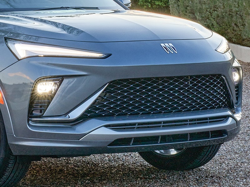 Close-up View of the Grille on a 2025 Buick Envista Avenir Luxury SUV Parked in a Gravel Driveway