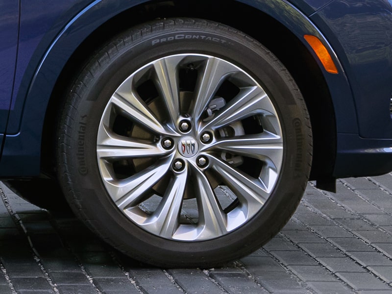 A Side Profile View of a Blue 2025 Buick Envista Parked in Driveway