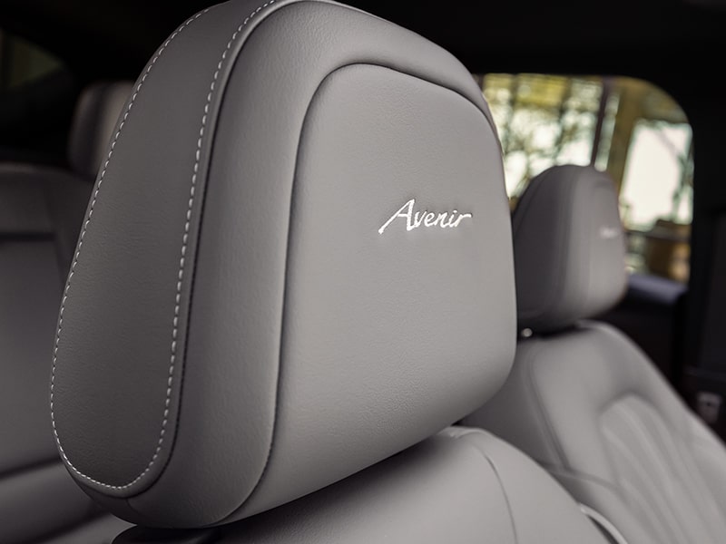 Close-up View of the 2025 Buick Envista Avenir Nameplate Embroidered on the Front Seat Headrest