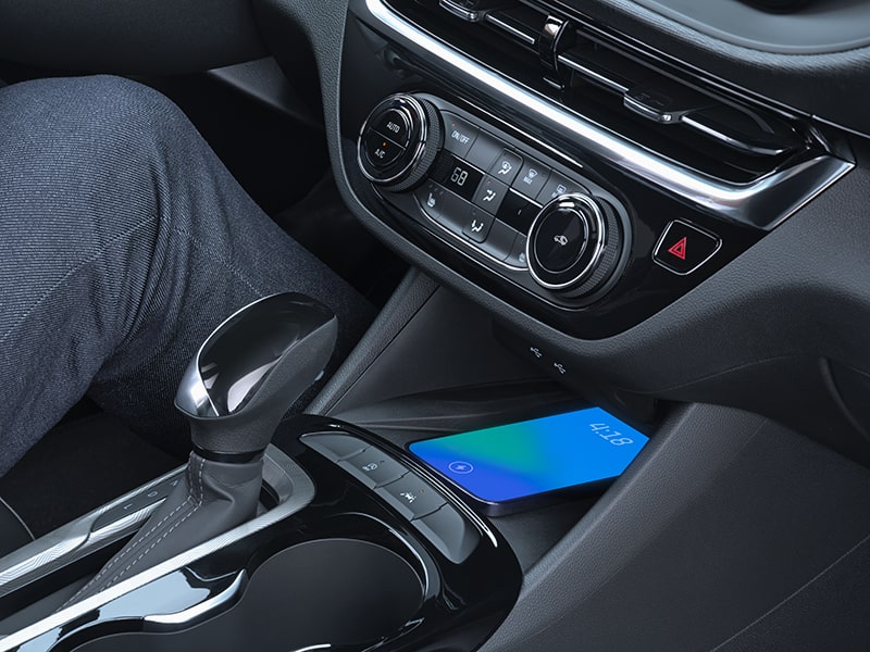 A Phone Charging on the 2025 Buick Envista Wireless Smartphone Charger on the Middle Console