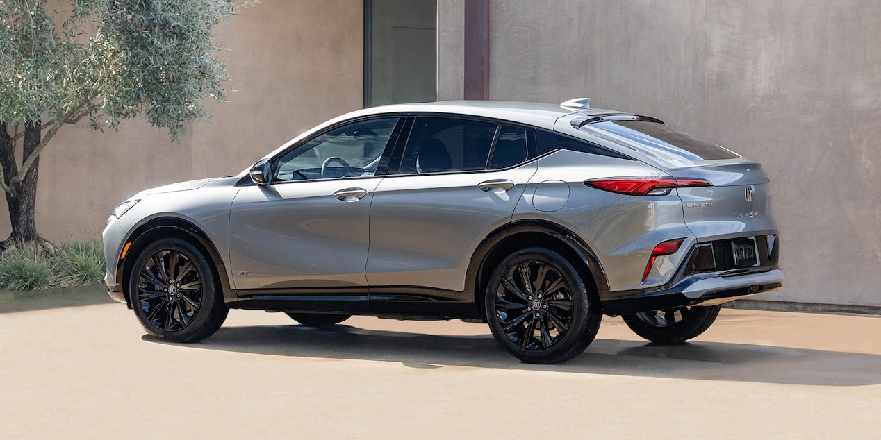 Driver Side View of the 2025 Buick Envista Parked by a Concrete Building