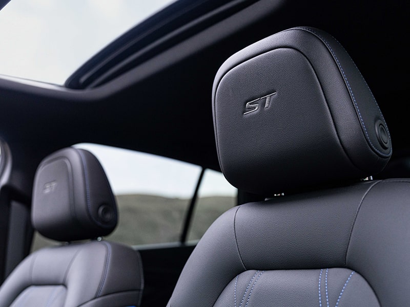 Close-up View of the 2025 Buick Envista Front Seat's Headrests and Open Sunroof