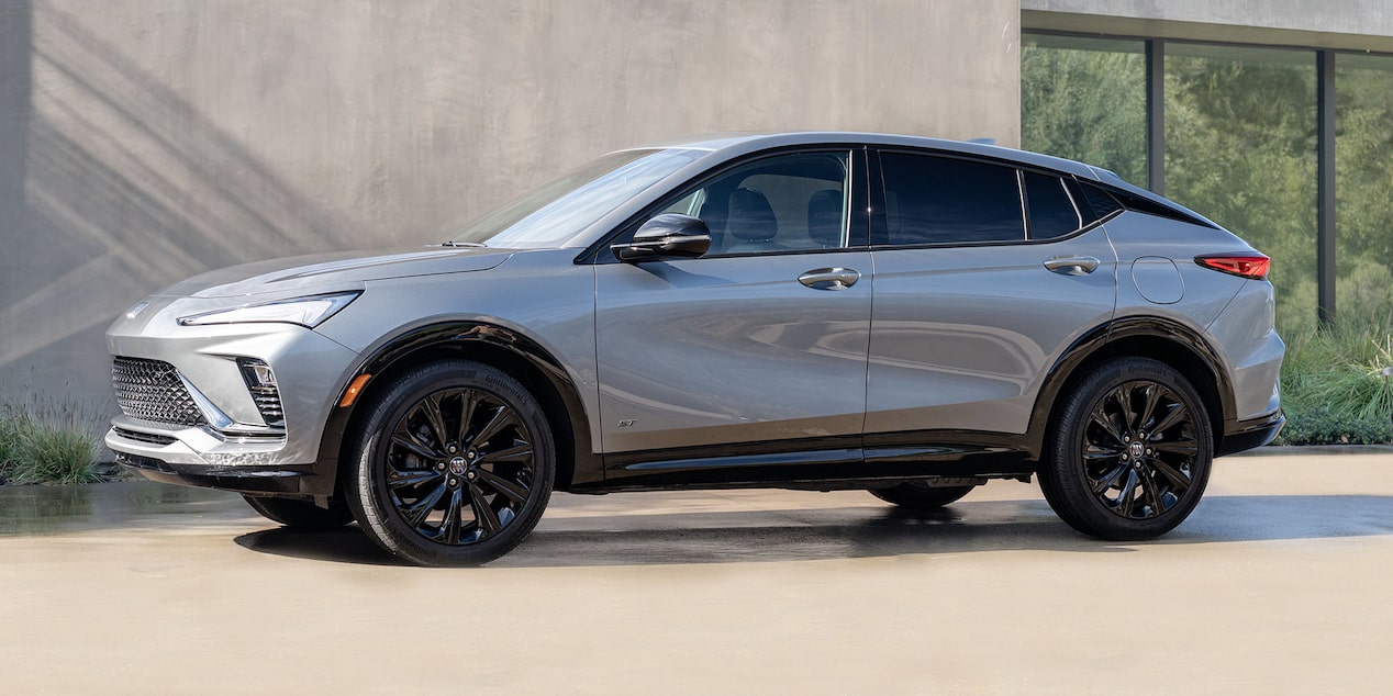 Driver Side View of the 2025 Buick Envista ST Sporty Crossover Parked by a Concrete Building