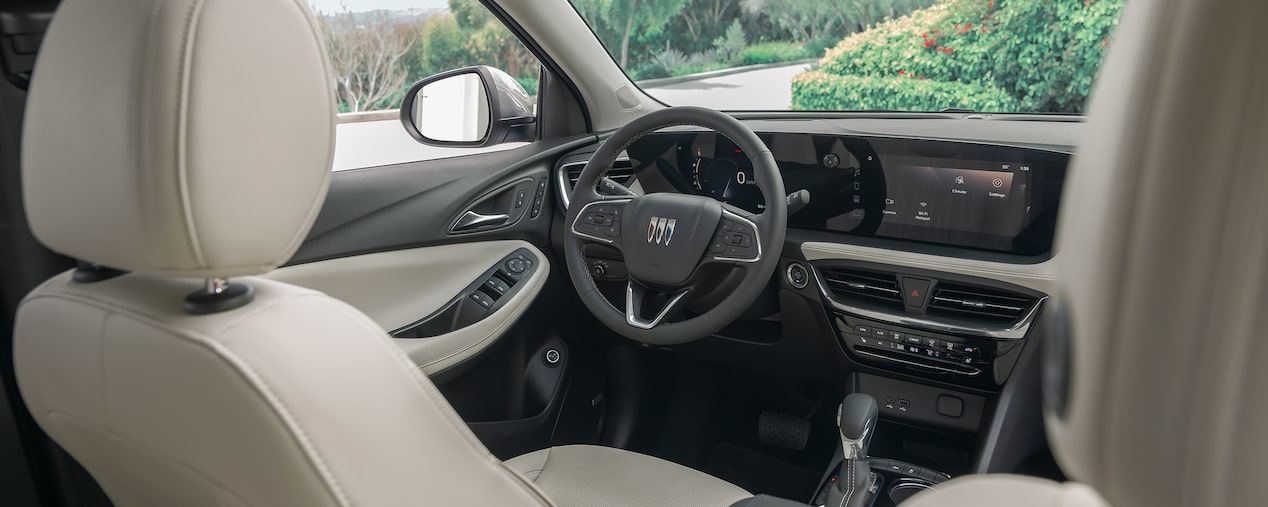 Back Seat View of Buick Driver Side's Steering Wheel and Sleek Infotainment System