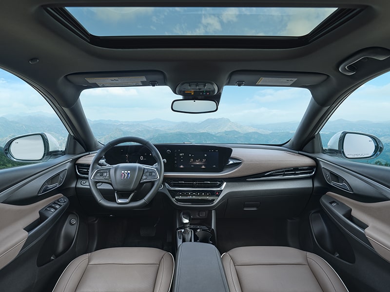 Rear Seat View of Front Interior Cabin in a Buick Vehicle Outlooking Stunning Mountains