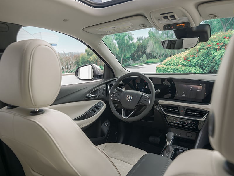 Back Seat View of Buick Driver Side's Steering Wheel and Sleek Infotainment System