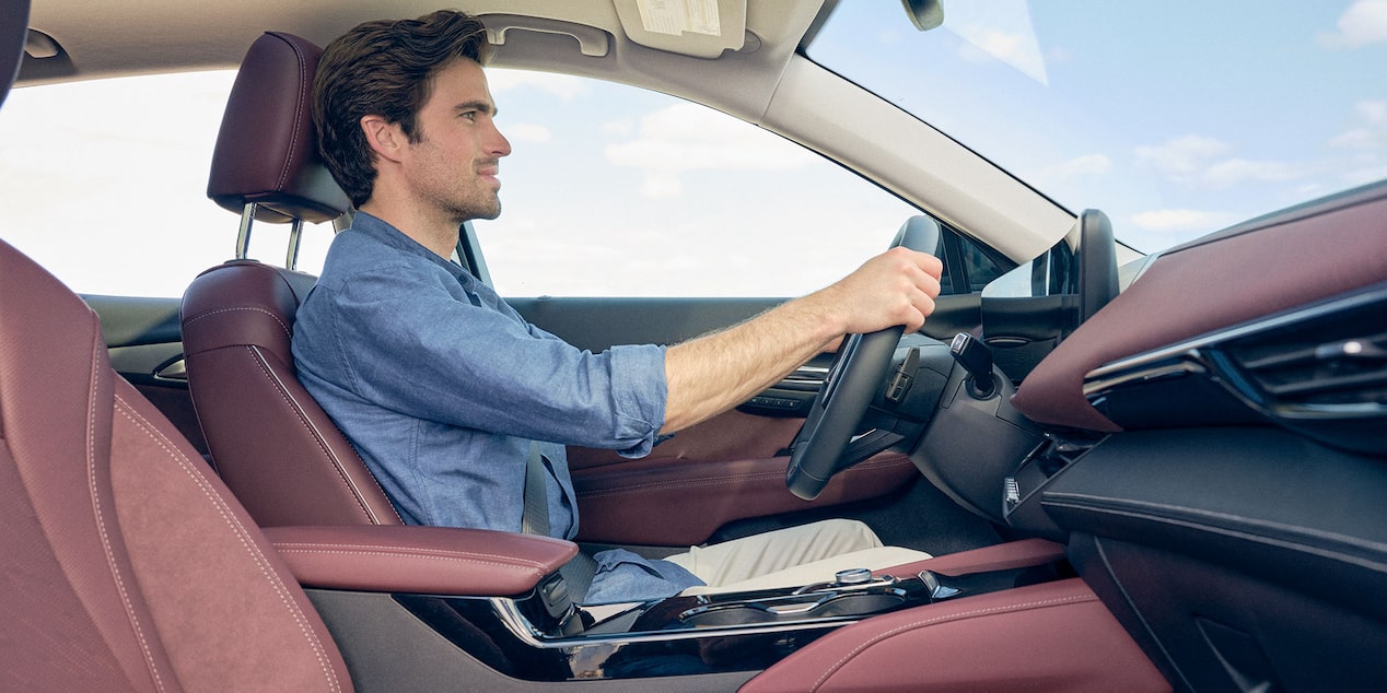 Side Profile View of a Man Driving in his Buick