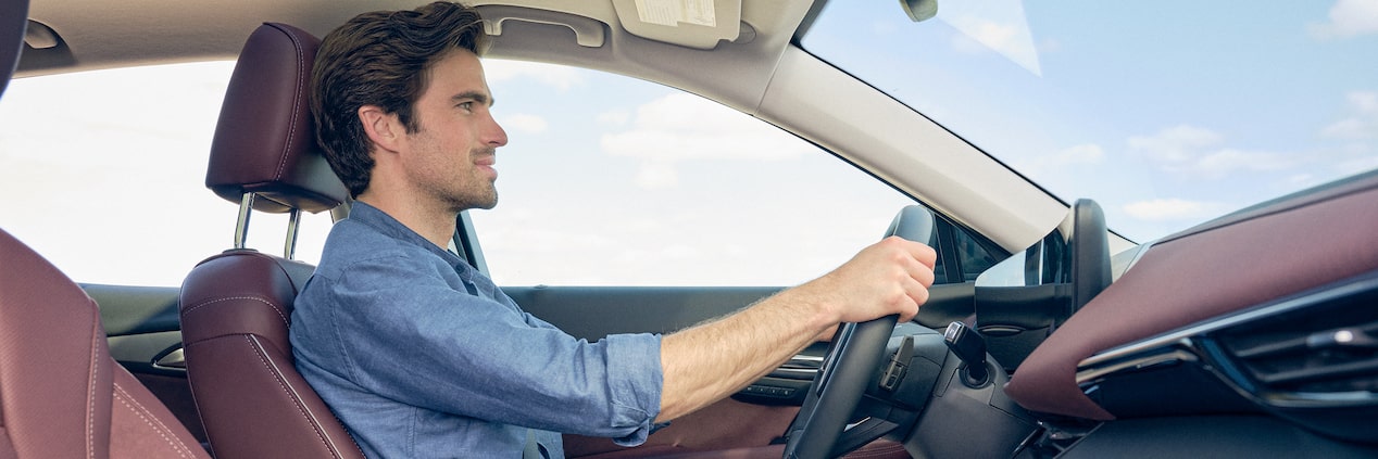 Side Profile View of a Man Driving in his Buick