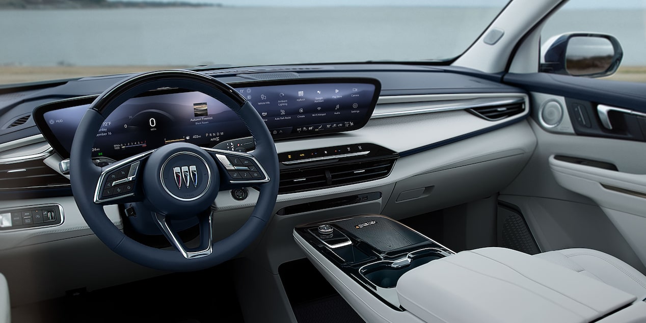 View From the Driver's Seat of a Buicks Interior Dashboard and Steering Wheel