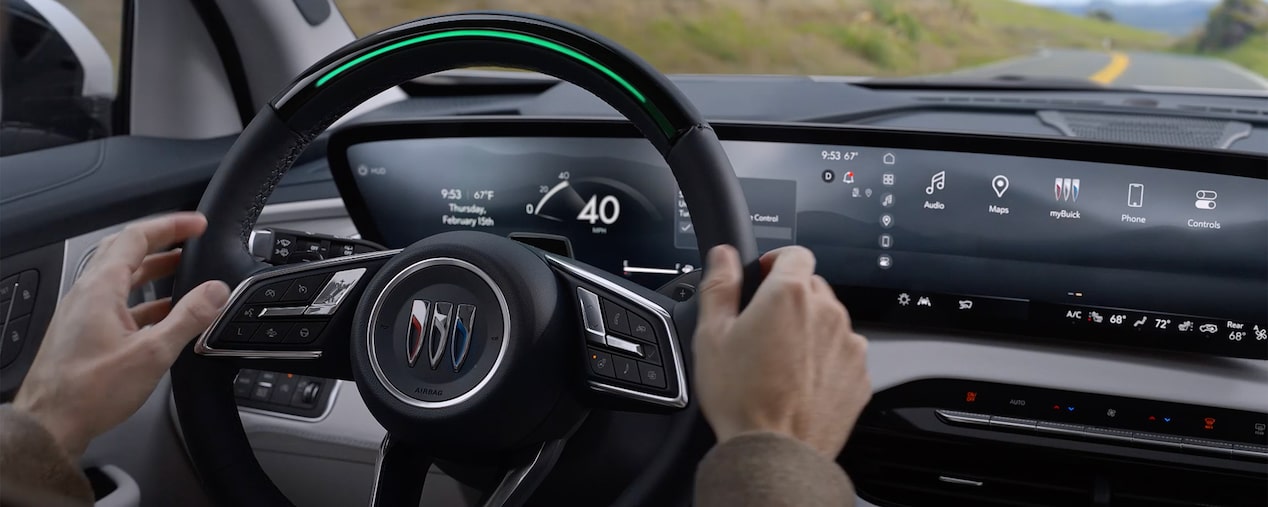 Close-up of a Buick Steering Wheel and Dashboard Displaying Super Cruise Hands-Free Driving Technology