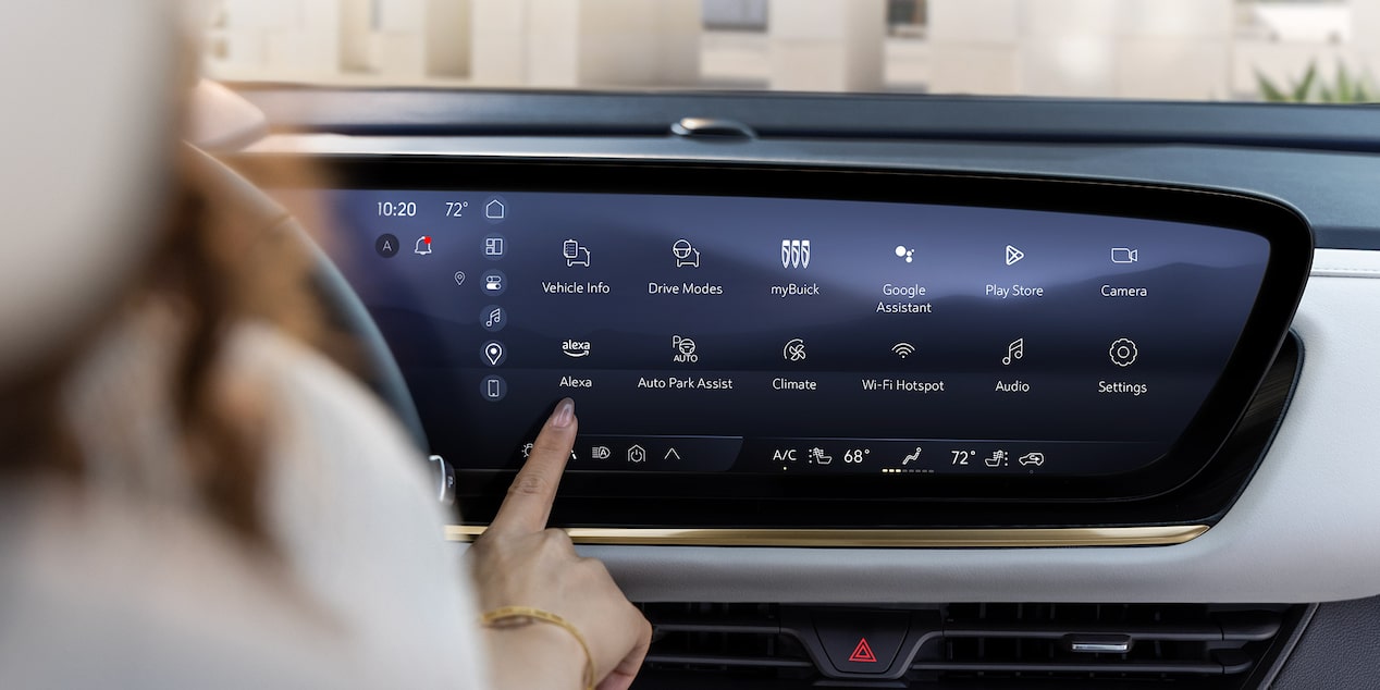 Women using the infotainment screen on a 2024 Buick Envision