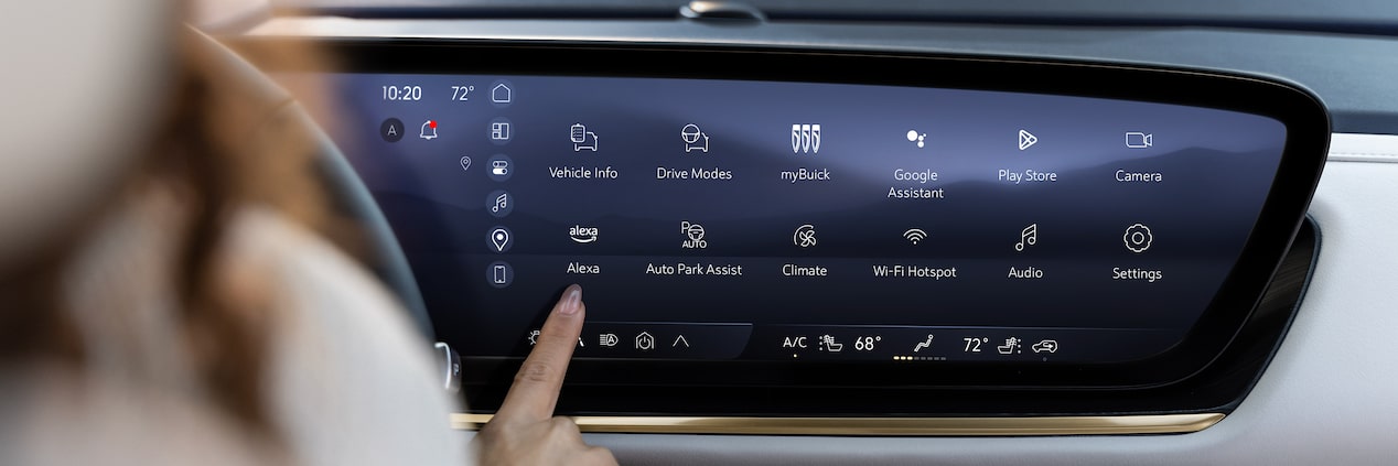 Women using the infotainment screen on a 2024 Buick Envision