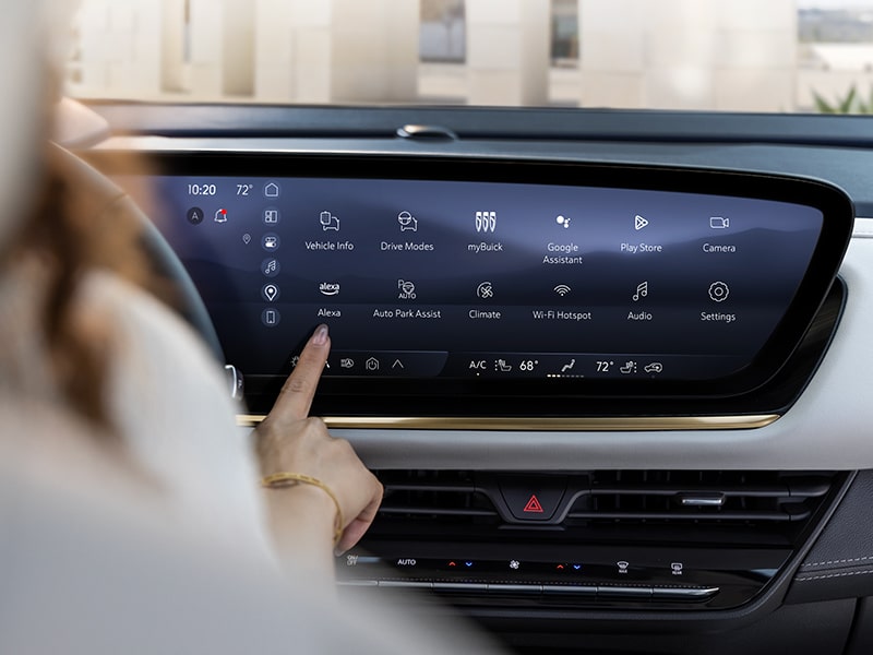 Women using the infotainment screen on a 2024 Buick Envision