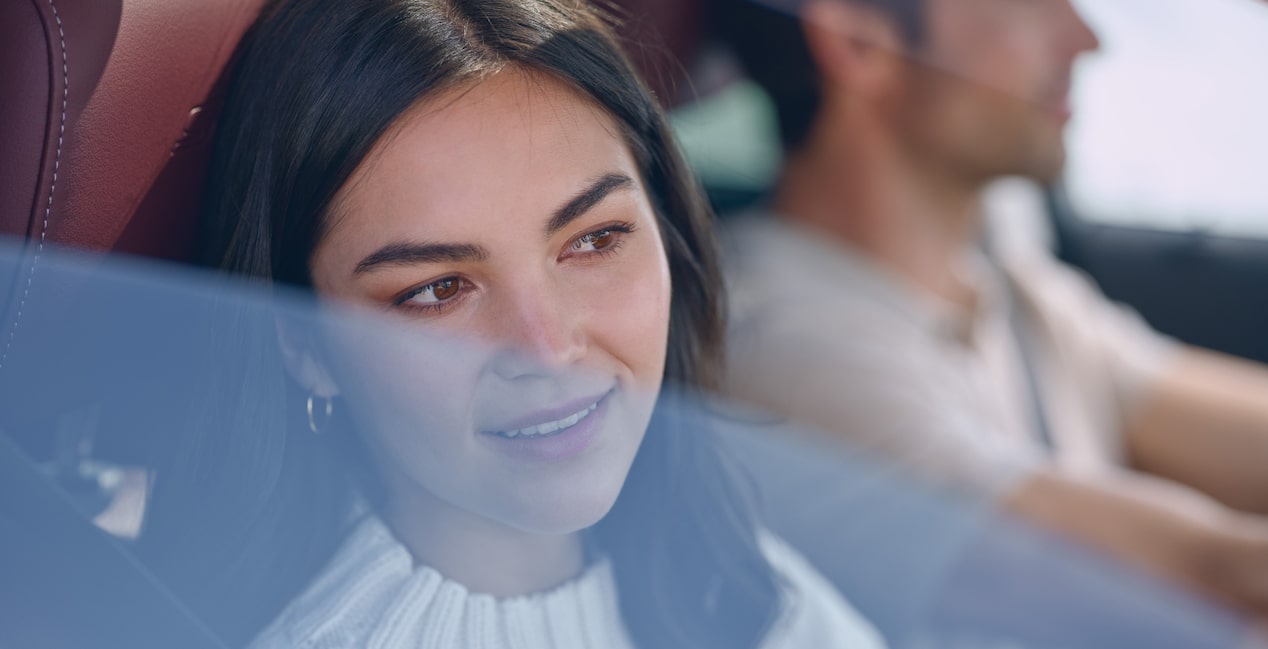 Women looking out the window in her Buick vehicle