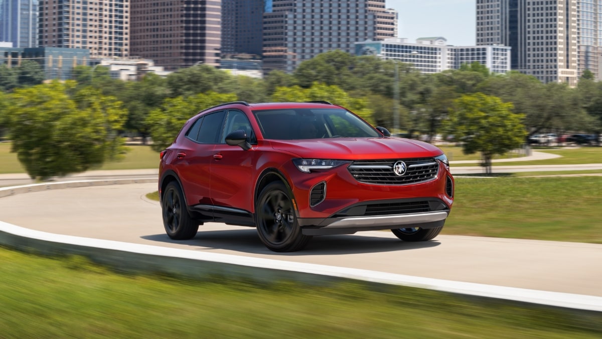 Buick SUV Driving on Highway with City in the Background