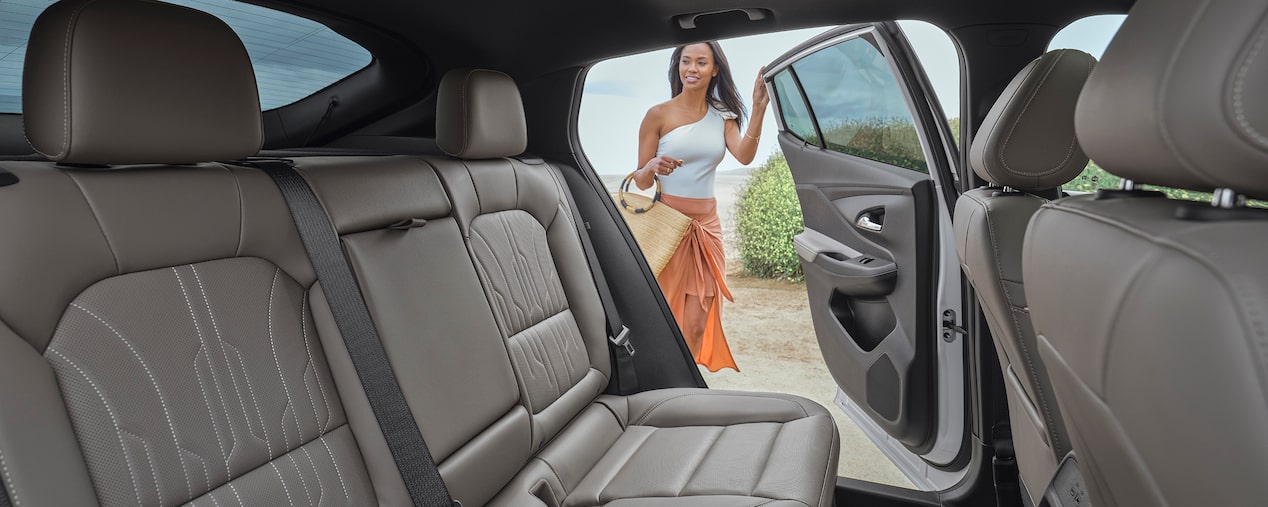 The Rear Seat View of the Buick Envista and a Woman Opening the Rear Side Door