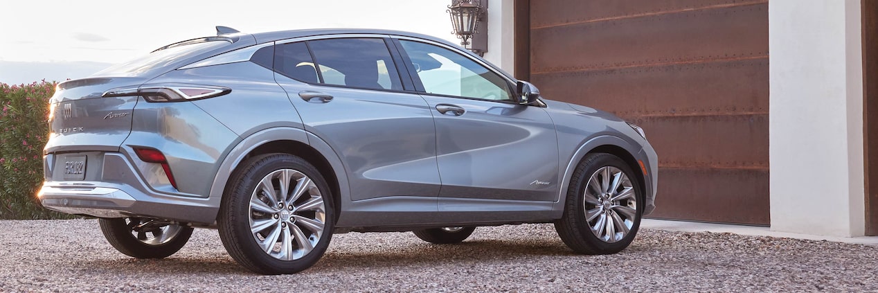 Rear View Passenger Side of the 2024 Buick Envista Parked in a gravel Driveway