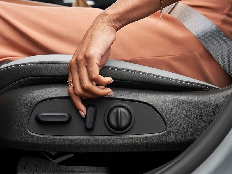 A Woman Adjusting her Seat in the Envista