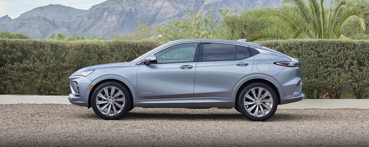 Driver Side View of the 2024 Buick Envista Parked in Front of Mountains