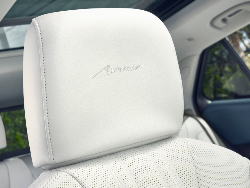 Close-up of a Buick Envision Avenir Cream-Colored Front Seat